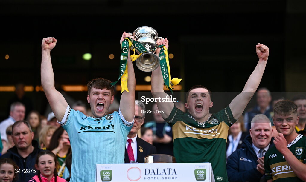 30 May 2026; Kerry players Kacper Robak, left, and Mark O’Carroll lift the Clarke Cup after their side's victory in the Dalata Hotels Group GAA Football All-Ireland U20 Championship final match between Kerry and Tyrone at Croke Park in Dublin. Photo by Seb Daly/Sportsfile