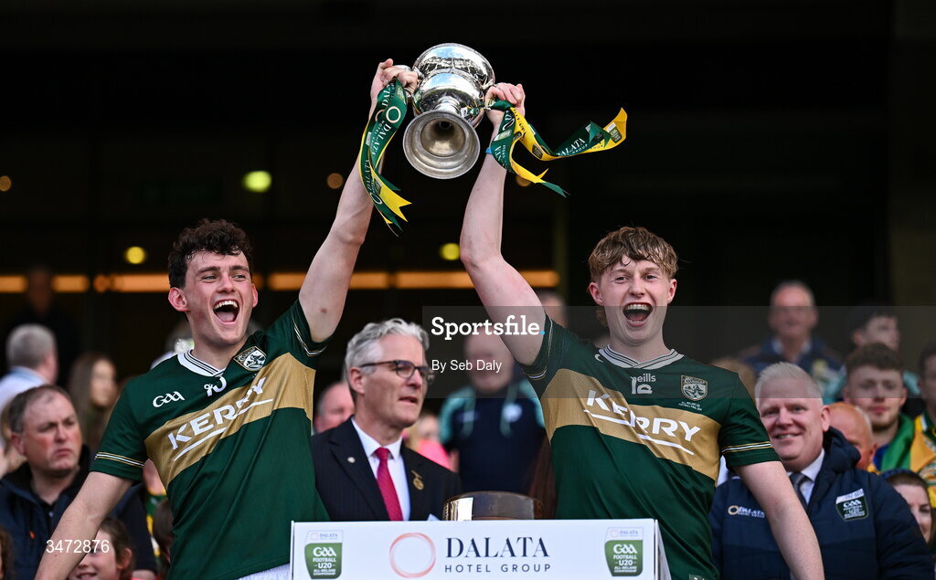 30 May 2026; Kerry players Jack O’Sullivan, left, and Killian Dennehy lift the Clarke Cup after their side's victory in the Dalata Hotels Group GAA Football All-Ireland U20 Championship final match between Kerry and Tyrone at Croke Park in Dublin. Photo by Seb Daly/Sportsfile