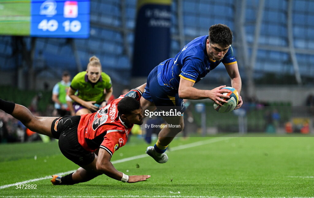 30 May 2026; Jimmy O'Brien of Leinster dives over to score his side's seventh try despite the tackle of Haashim Pead of Lions during the United Rugby Championship quarter-final match between Leinster and Lions at the Aviva Stadium in Dublin. Photo by Brendan Moran/Sportsfile