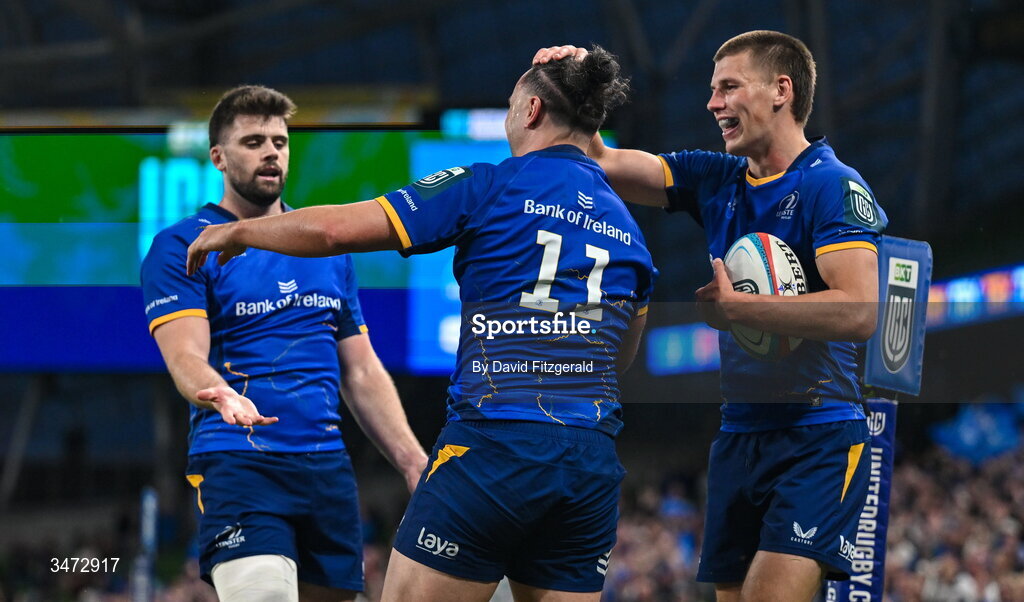 30 May 2026; James Lowe of Leinster, 11, celebrates with teammates Sam Prendergast, right, and Harry Byrne after scoring their side's ninth try during the United Rugby Championship quarter-final match between Leinster and Lions at the Aviva Stadium in Dublin. Photo by David Fitzgerald/Sportsfile