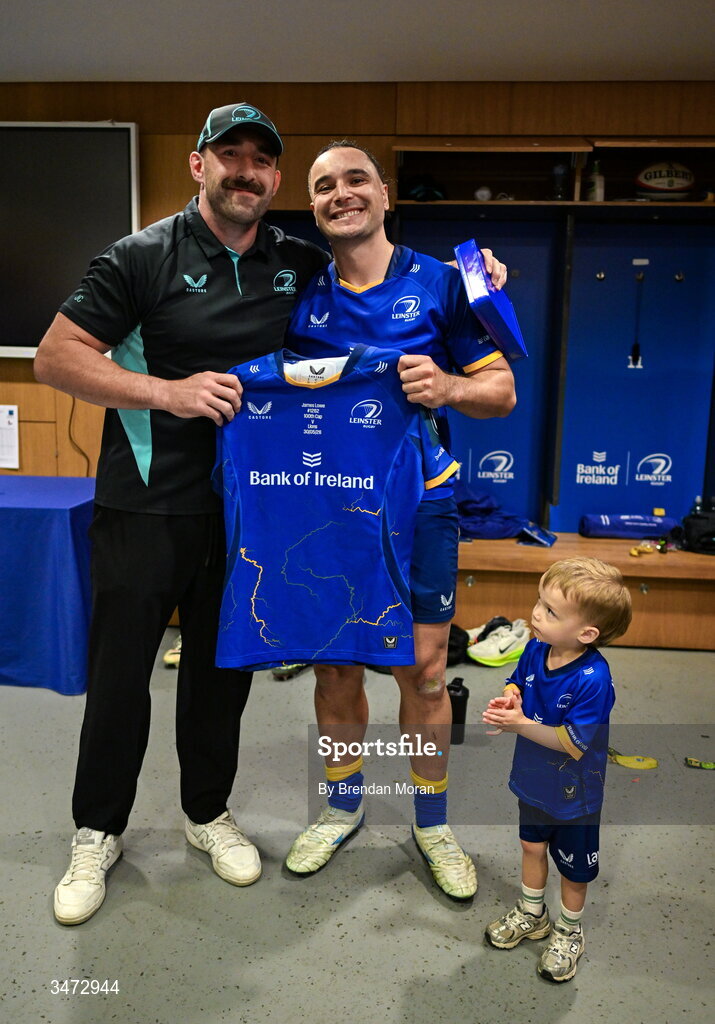 30 May 2026; James Lowe of Leinster, centre, is presented with a jersey to mark his 100th cap by team-mate Jack Conan while being applauded by his son Nico after the United Rugby Championship quarter-final match between Leinster and Lions at the Aviva Stadium in Dublin. Photo by Brendan Moran/Sportsfile