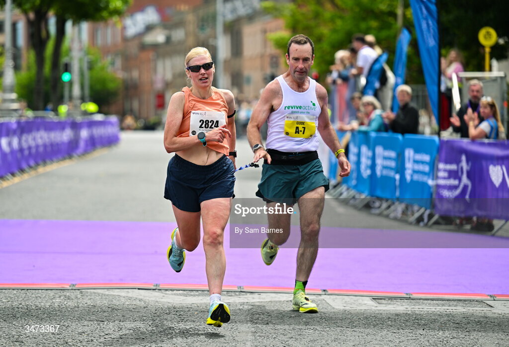 31 May 2026; Sinead Kane of Le Cheile AC crosses the line to finish second in the Visually Impaired category of the 2026 Vhi Women’s Mini Marathon. Almost 30,000 women from all over the country took to the streets of Dublin to run, walk and jog the 10km route, raising much needed funds for hundreds of charities around the country. www.vhiwomensminimarathon.ie. Photo by Sam Barnes/Sportsfile