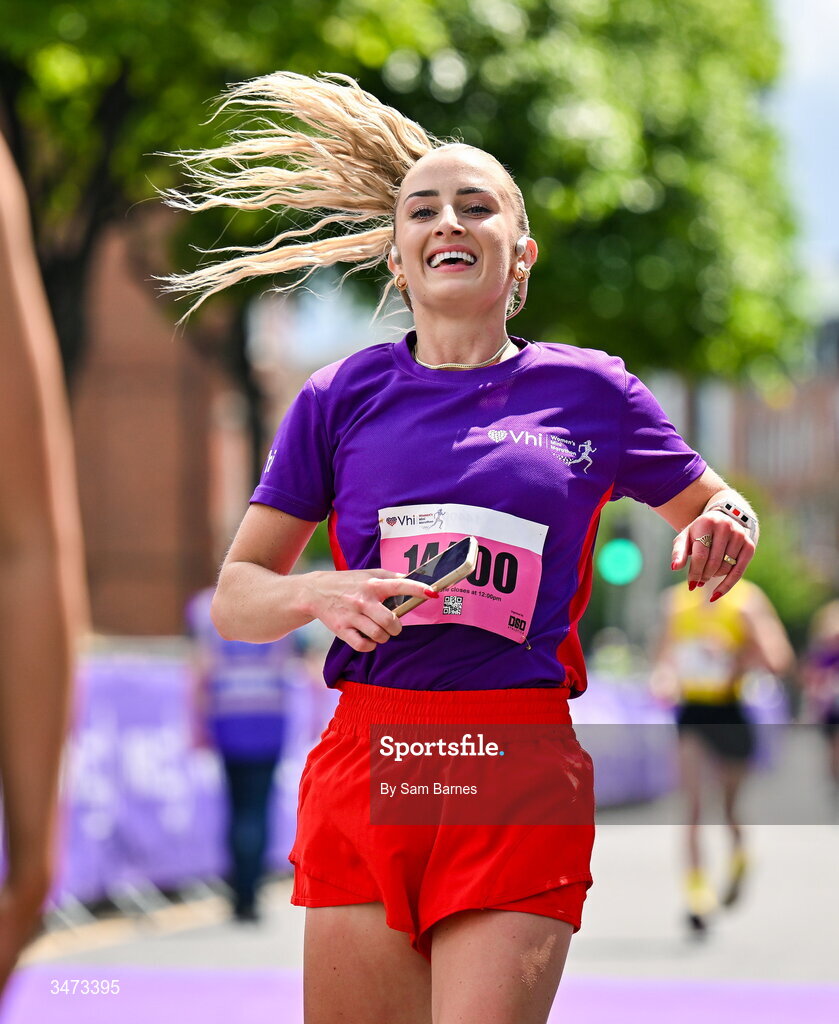 31 May 2026; VHI ambassador Nathalie Lennon crosses the line during the 2026 Vhi Women’s Mini Marathon. Almost 30,000 women from all over the country took to the streets of Dublin to run, walk and jog the 10km route, raising much needed funds for hundreds of charities around the country. www.vhiwomensminimarathon.ie. Photo by Sam Barnes/Sportsfile