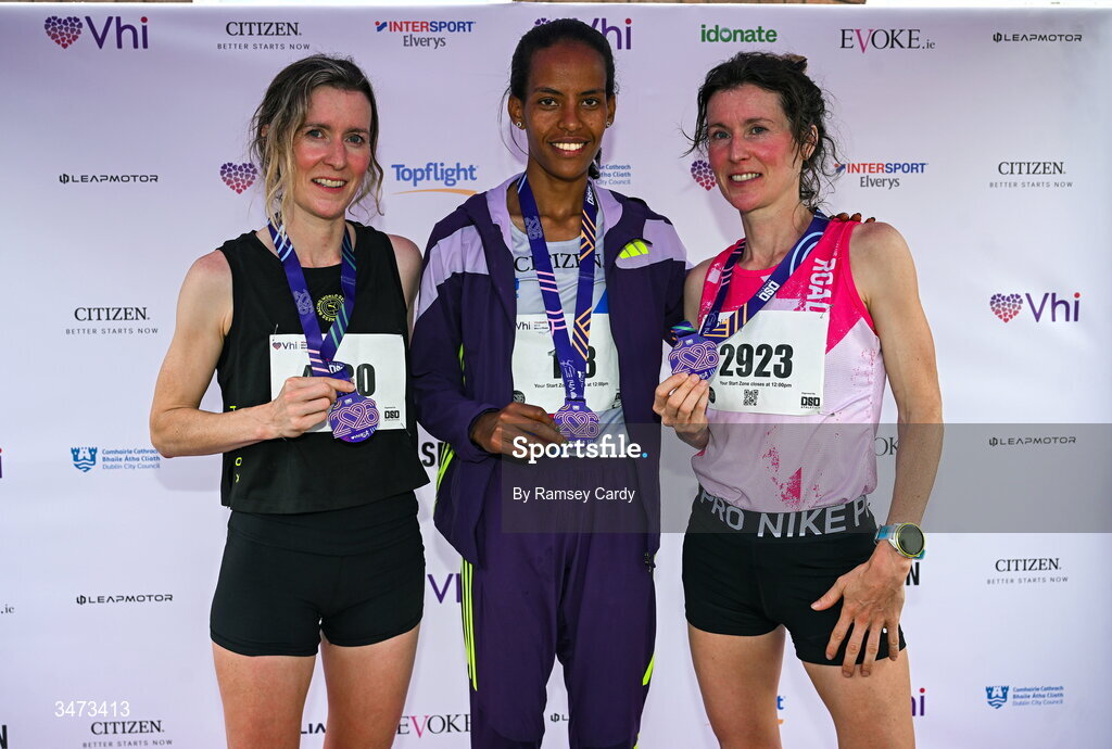 31 May 2026; Top 3 finishers, from left, third place Ide Nic Dhomhnaill, winner Chaltu Dida, and second place Sorcha Nic Dhomhnaill on the podium during the 2026 Vhi Women’s Mini Marathon. Almost 30,000 women from all over the country took to the streets of Dublin to run, walk and jog the 10km route, raising much needed funds for hundreds of charities around the country. www.vhiwomensminimarathon.ie. Photo by Ramsey Cardy/Sportsfile
