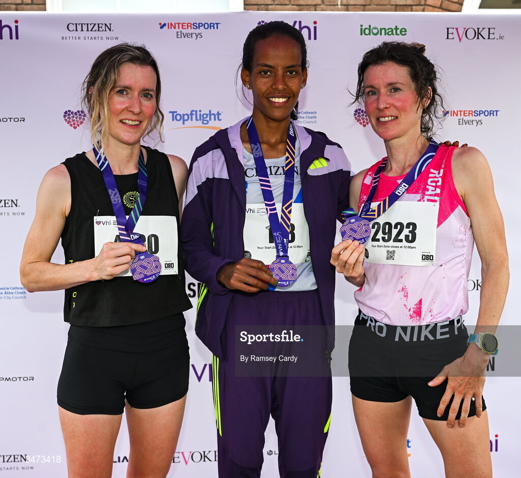 31 May 2026; Top 3 finishers, from left, third place Ide Nic Dhomhnaill, winner Chaltu Dida, and second place Sorcha Nic Dhomhnaill on the podium during the 2026 Vhi Women’s Mini Marathon. Almost 30,000 women from all over the country took to the streets of Dublin to run, walk and jog the 10km route, raising much needed funds for hundreds of charities around the country. www.vhiwomensminimarathon.ie. Photo by Ramsey Cardy/Sportsfile