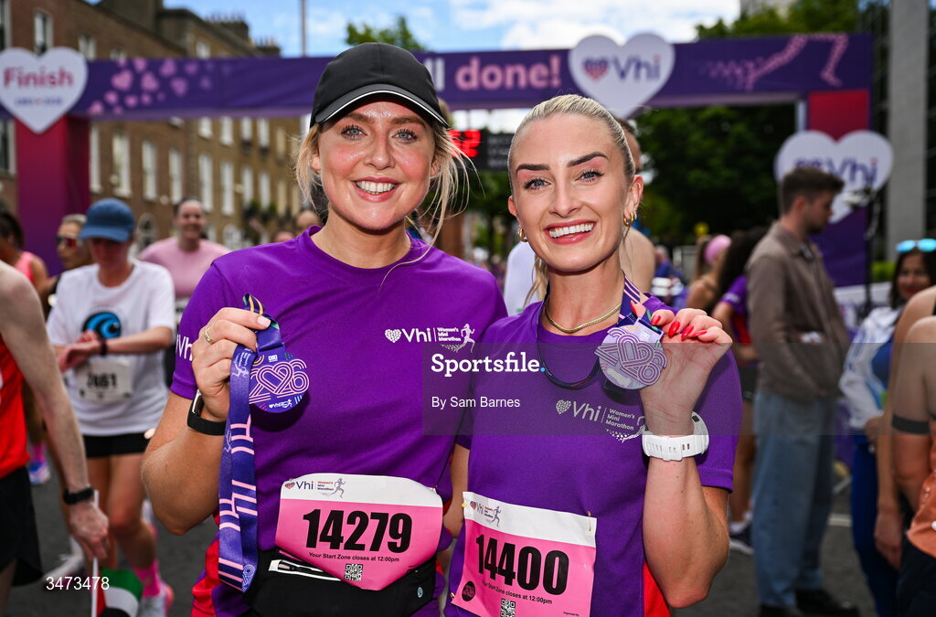 31 May 2026; VHI ambassadors Aimee Connolly, left, and Nathalie Lennon celebrate with their medals after the 2026 Vhi Women’s Mini Marathon. Almost 30,000 women from all over the country took to the streets of Dublin to run, walk and jog the 10km route, raising much needed funds for hundreds of charities around the country. www.vhiwomensminimarathon.ie. Photo by Sam Barnes/Sportsfile