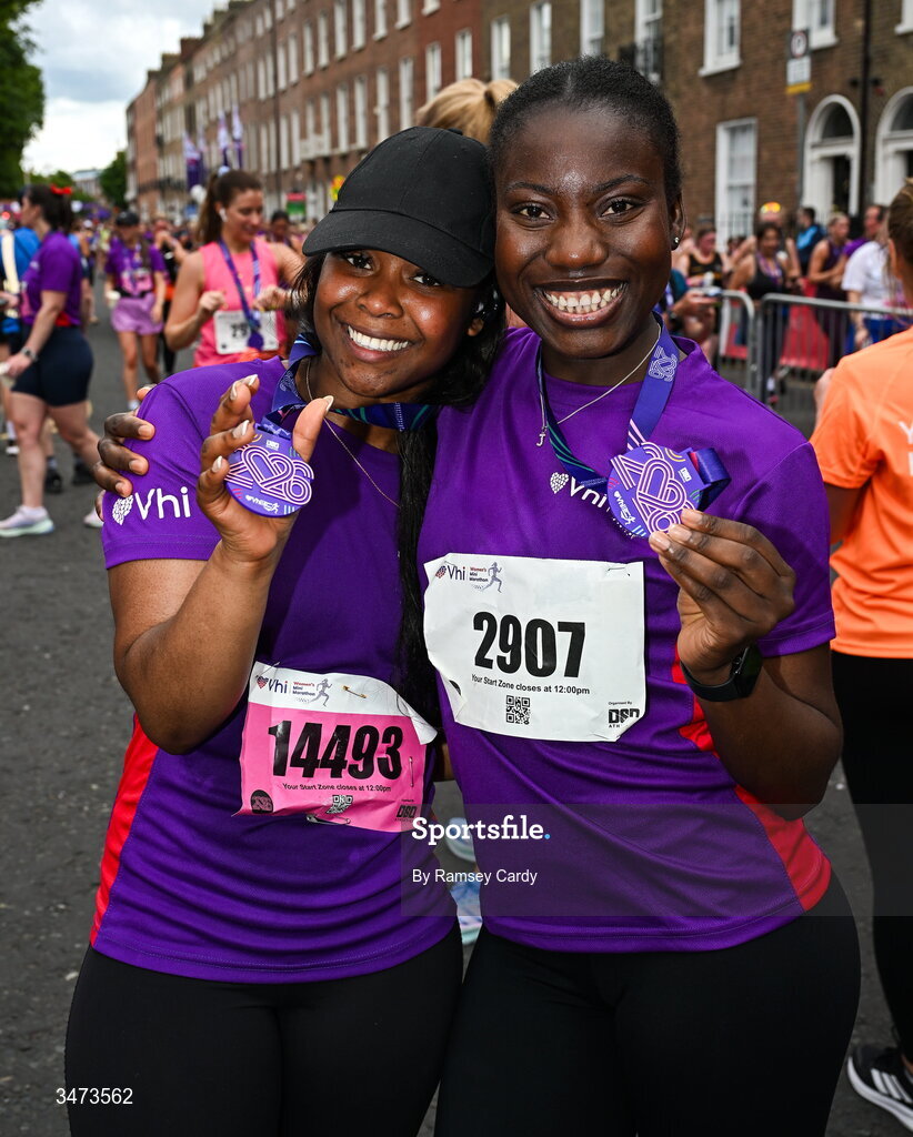 31 May 2026; Pelumi Daramola, left, and Juliet Aimuanmwosa with their medals after the 2026 Vhi Women’s Mini Marathon. Almost 30,000 women from all over the country took to the streets of Dublin to run, walk and jog the 10km route, raising much needed funds for hundreds of charities around the country. www.vhiwomensminimarathon.ie. Photo by Ramsey Cardy/Sportsfile