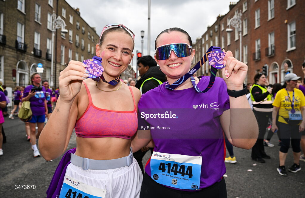 31 May 2026; Emily, left, and Lucy McNamara from Malahide, Dublin, with their medals after the 2026 Vhi Women’s Mini Marathon. Almost 30,000 women from all over the country took to the streets of Dublin to run, walk and jog the 10km route, raising much needed funds for hundreds of charities around the country. www.vhiwomensminimarathon.ie. Photo by Sam Barnes/Sportsfile