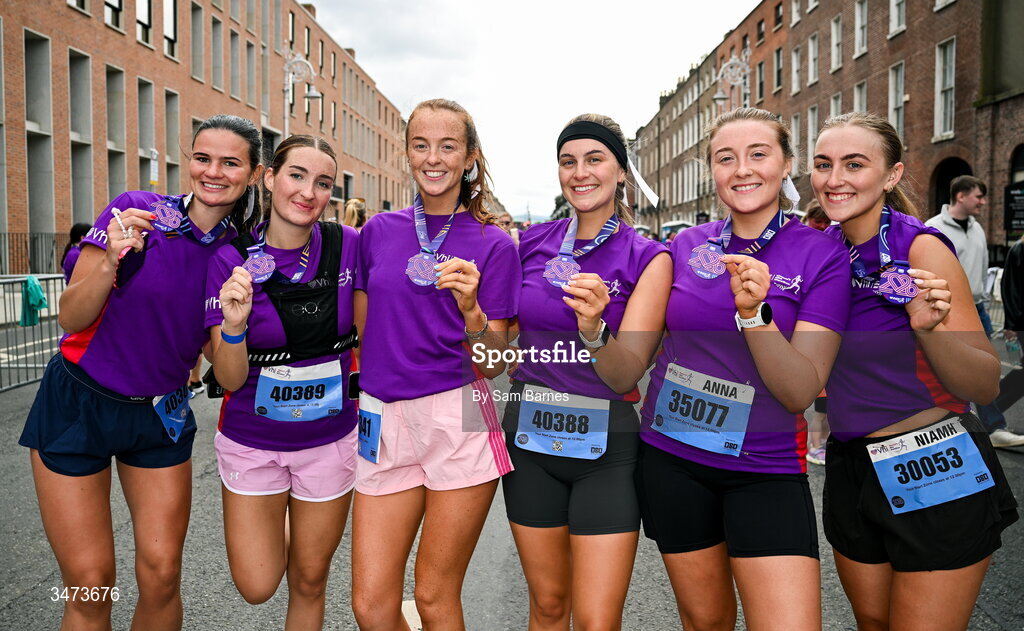 31 May 2026; Participants celebrate with their medals after the 2026 Vhi Women’s Mini Marathon. Almost 30,000 women from all over the country took to the streets of Dublin to run, walk and jog the 10km route, raising much needed funds for hundreds of charities around the country. www.vhiwomensminimarathon.ie. Photo by Sam Barnes/Sportsfile