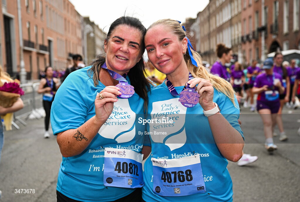 31 May 2026; Stephanie, left, and Chelsea Murphy, running for Harold's Cross Hospice, celebrate with their medals after the 2026 Vhi Women’s Mini Marathon. Almost 30,000 women from all over the country took to the streets of Dublin to run, walk and jog the 10km route, raising much needed funds for hundreds of charities around the country. www.vhiwomensminimarathon.ie. Photo by Sam Barnes/Sportsfile
