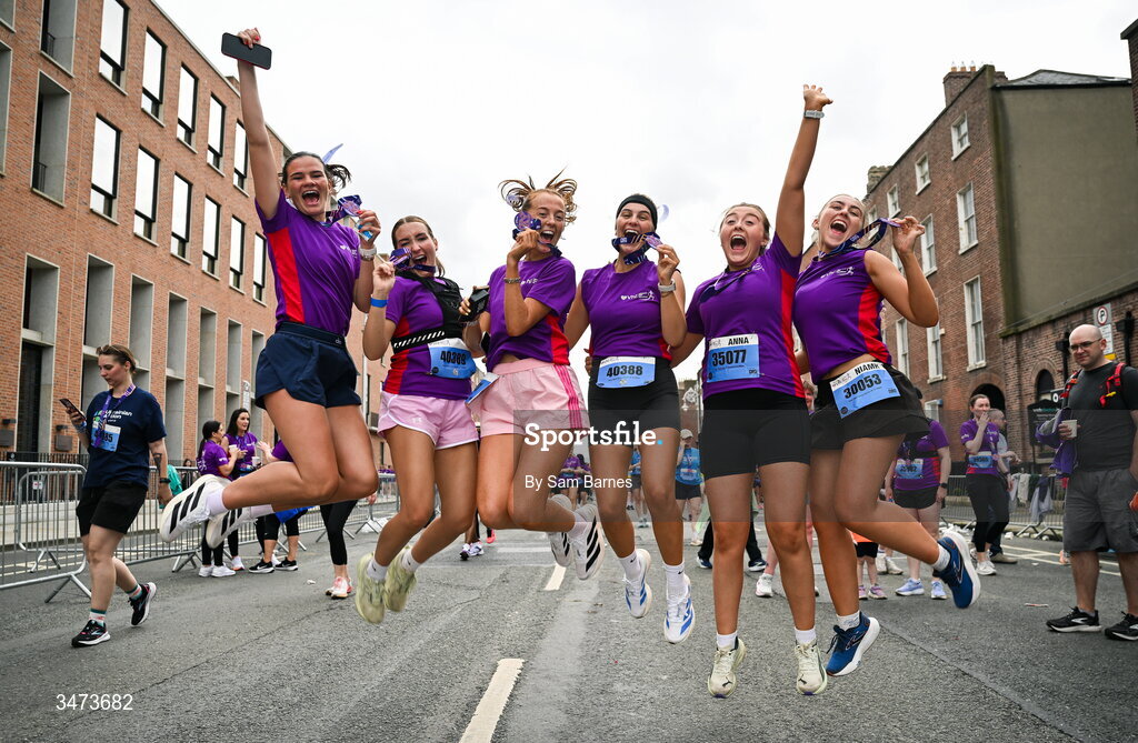 31 May 2026; Participants celebrate with their medals after the 2026 Vhi Women’s Mini Marathon. Almost 30,000 women from all over the country took to the streets of Dublin to run, walk and jog the 10km route, raising much needed funds for hundreds of charities around the country. www.vhiwomensminimarathon.ie. Photo by Sam Barnes/Sportsfile