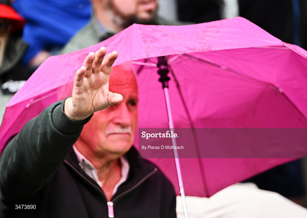31 May 2026; A spectator puts his hand out from under his umbrella to test the rain before the GAA Football All-Ireland Senior Championship Round 1 match between Monaghan and Mayo at St Tiernach's Park in Clones, Monaghan. Photo by Piaras Ó Mídheach/Sportsfile