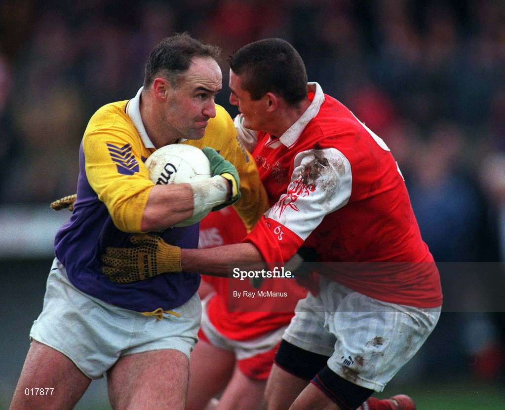 31 January 1999; Conor Deegan of  Kilmacud Crokes is tackled by Jody Morrissey of Éire Og during the AIB Leinster Club Football Championship Final 2nd Replay match between Éire Og and Kilmacud Crokes at St Conleths Park in Newbridge, Kildare. Photo by Ray McManus/Sportsfile