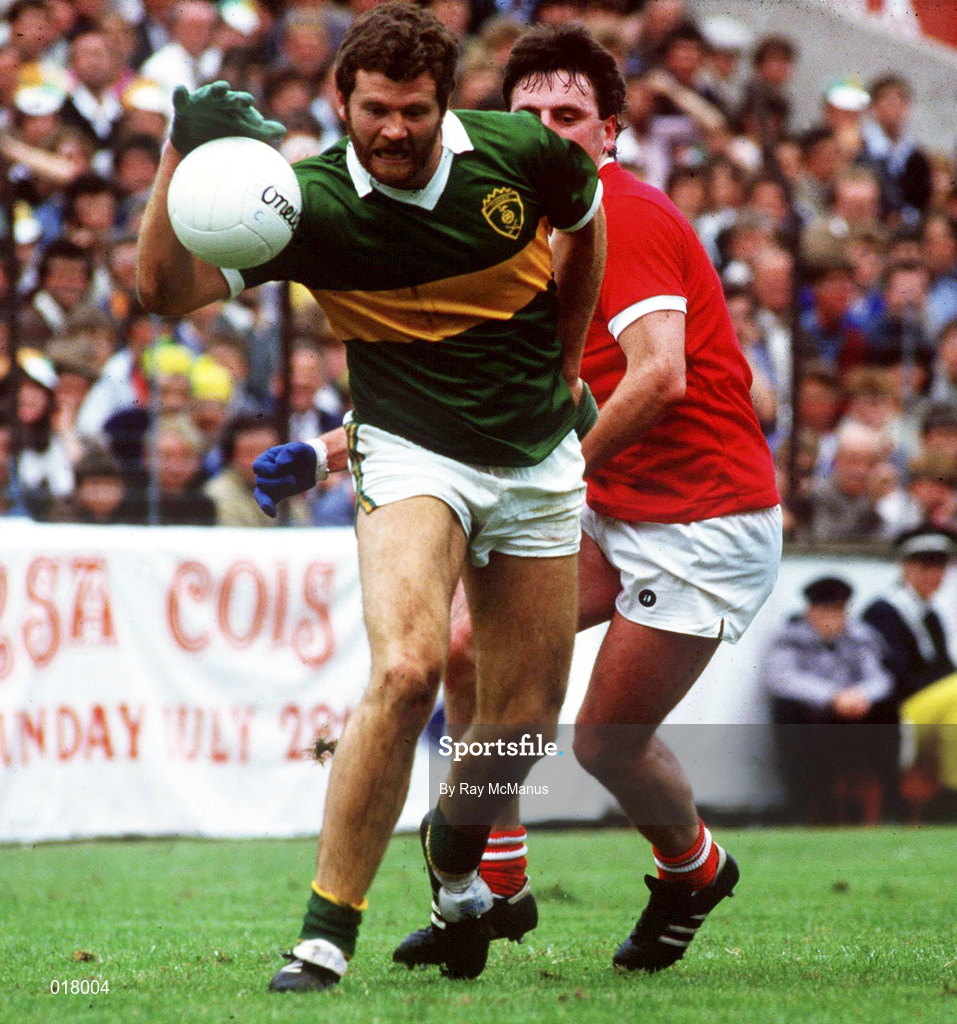 21 July 1985;  Eoin Liston of Kerry in action against Jimmy Kerrigan of Cork during the Munster Senior Football Championship Final match between Kerry and Cork at Páirc Ui Chaoimh on Cork. Photo by Ray McManus/Sportsfile