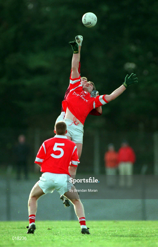 14 February 1999; Liam Honohan of Cork in action against Sean O'Domhnaill of Galway as Donagh Wiseman of Cork  looks on during the Church & General National Football League Division 1 match between Cork and Galway at Páirc Uí Rinn in Cork. Photo by Brendan Moran/Sportsfile