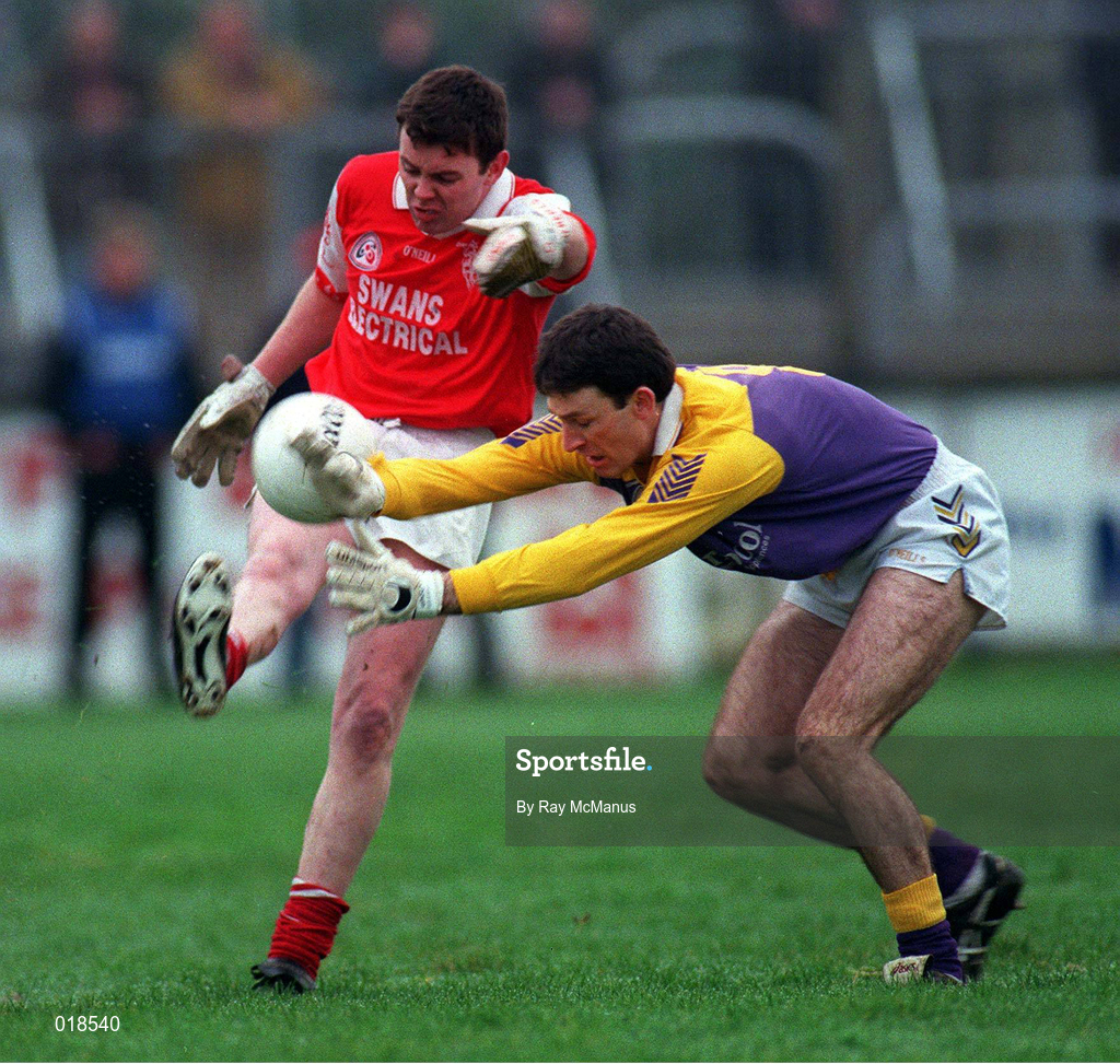31 January 1999; Tom Nolan of Éire Og in action against John Costello of Kilmacud Crokes during the AIB Leinster Club Football Championship Final 2nd Replay match between Éire Og and Kilmacud Crokes at St Conleths Park in Newbridge, Kildare. Photo by Ray McManus/Sportsfile
