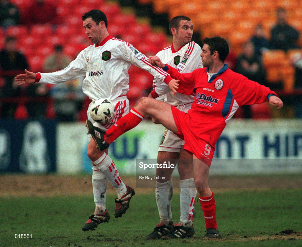 31 January 1999: Tony Sheirdan of Shelbourne in action against Kelvin Flanagan, left, and Derek Coughlan of Cork City during the Harp Lager National League Premier Division match between Shelbourne and Cork City at Tolka Park in Dublin. Photo by Ray Lohan/Sportsfile