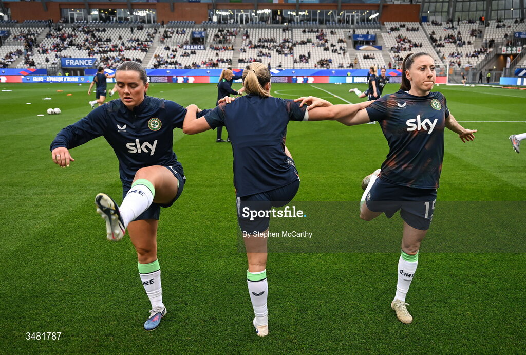 9 June 2026; Tyler Toland, Jamie Finn and Lucy Quinn of Republic of Ireland warm up before the 2027 FIFA Women’s World Cup Qualifier match between France and Republic of Ireland at Stade des Alpes in Grenoble, France. Photo by Stephen McCarthy/Sportsfile