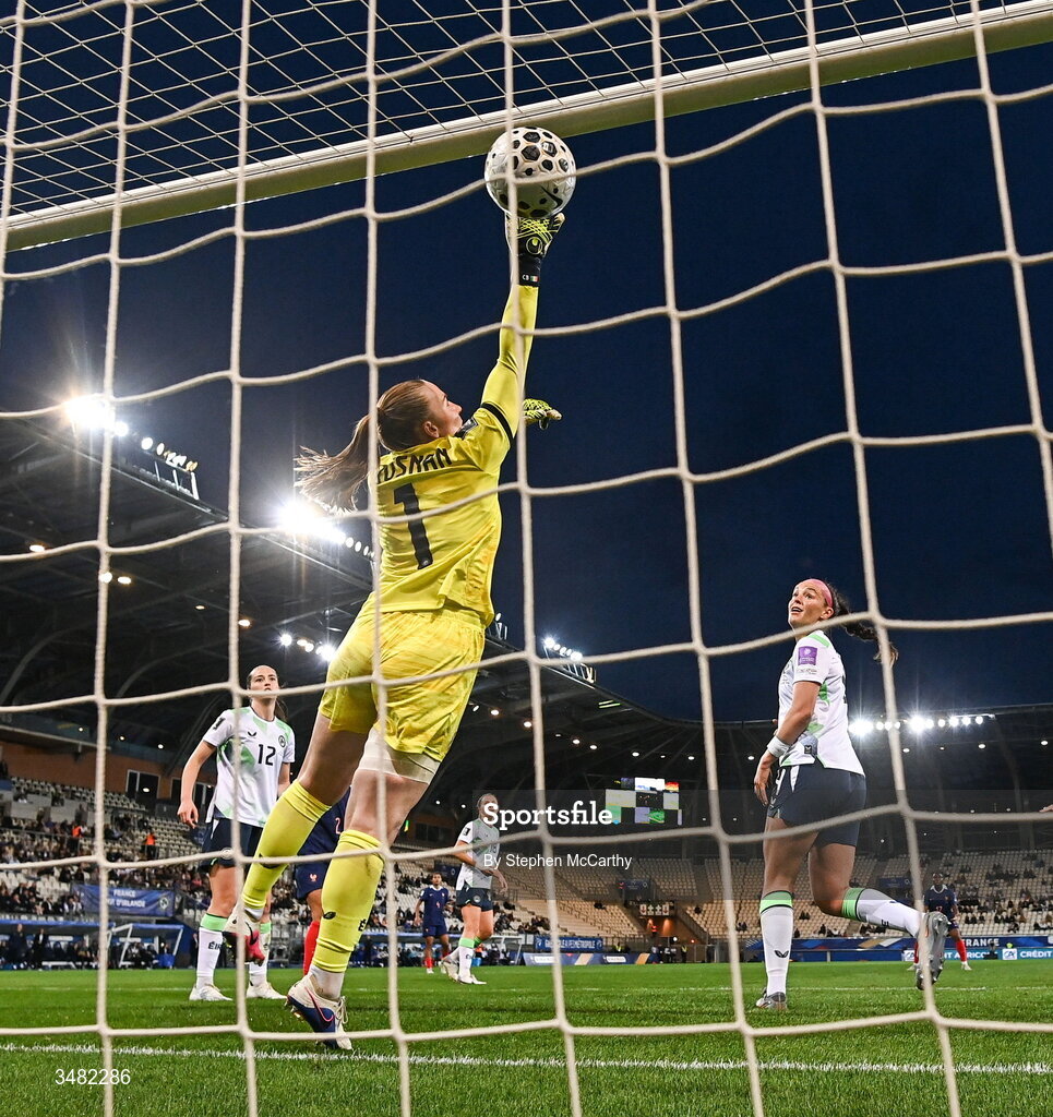 9 June 2026; Melvine Malard of France, not pictured, shoots to score her side's first goal as Republic of Ireland goalkeeper Courtney Brosnan attempts to make a save during the 2027 FIFA Women’s World Cup Qualifier match between France and Republic of Ireland at Stade des Alpes in Grenoble, France. Photo by Stephen McCarthy/Sportsfile