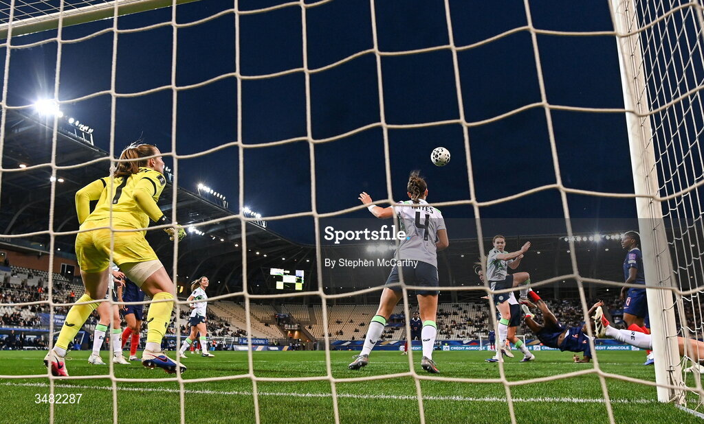 9 June 2026; Melvine Malard of France, second from right, shoots to score her side's first goal as Republic of Ireland goalkeeper Courtney Brosnan attempts to make a save during the 2027 FIFA Women’s World Cup Qualifier match between France and Republic of Ireland at Stade des Alpes in Grenoble, France. Photo by Stephen McCarthy/Sportsfile
