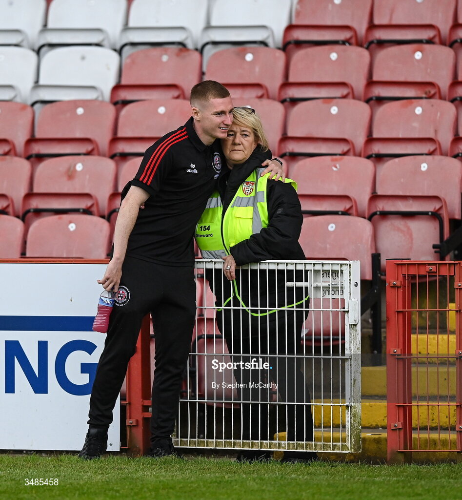12 June 2026; Ross Tierney of Bohemians greets his aunt Ann O'Driscoll before the SSE Airtricity Men’s Premier Division match between Derry City and Bohemians at Find Insurance Celtic Park in Derry. Photo by Stephen McCarthy/Sportsfile