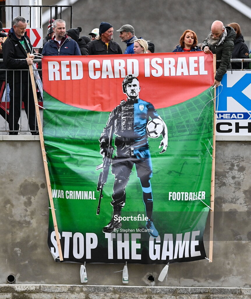 12 June 2026; Supporters unfurl a banner reading "Red Card Israel" and "Stop The Game" during the SSE Airtricity Men’s Premier Division match between Derry City and Bohemians at Find Insurance Celtic Park in Derry. Photo by Stephen McCarthy/Sportsfile