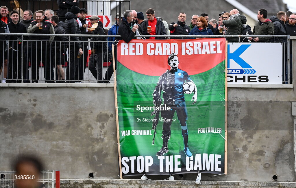 12 June 2026; Supporters unfurl a banner reading "Red Card Israel" and "Stop The Game" during the SSE Airtricity Men’s Premier Division match between Derry City and Bohemians at Find Insurance Celtic Park in Derry. Photo by Stephen McCarthy/Sportsfile