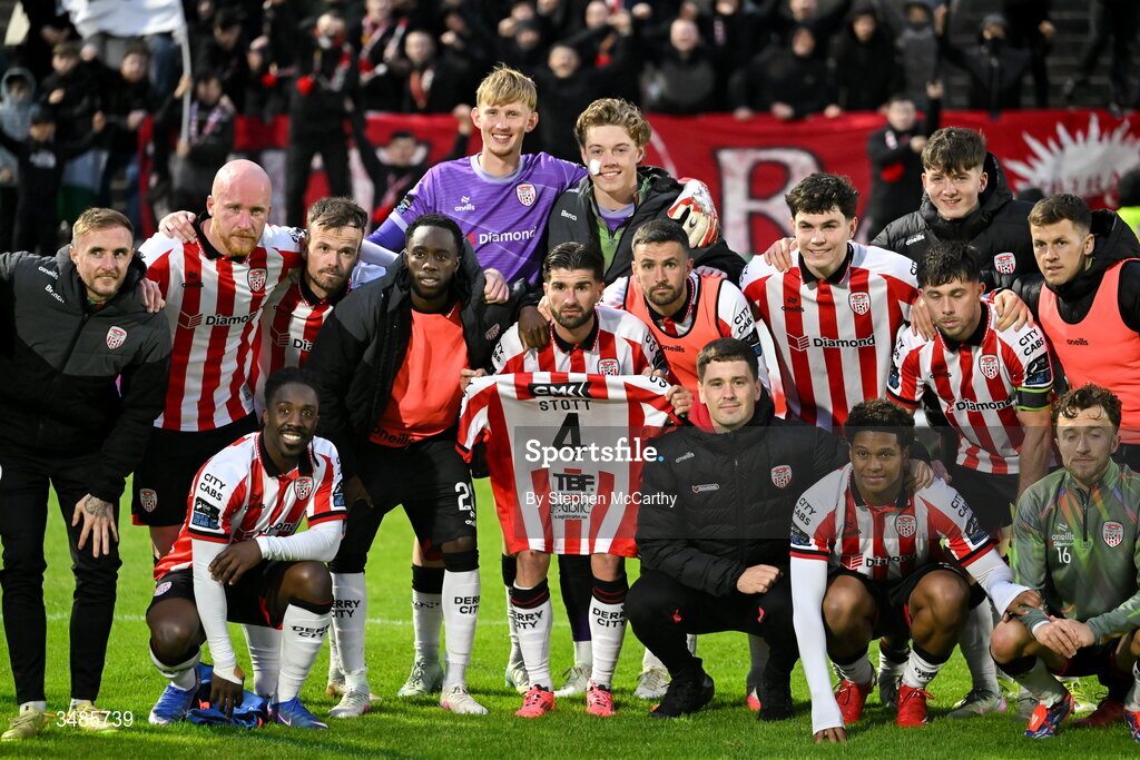 12 June 2026; Derry City players pose for a photograph while holding up a jersey belong to team-mate Jamie Stott after the SSE Airtricity Men’s Premier Division match between Derry City and Bohemians at Find Insurance Celtic Park in Derry. Photo by Stephen McCarthy/Sportsfile