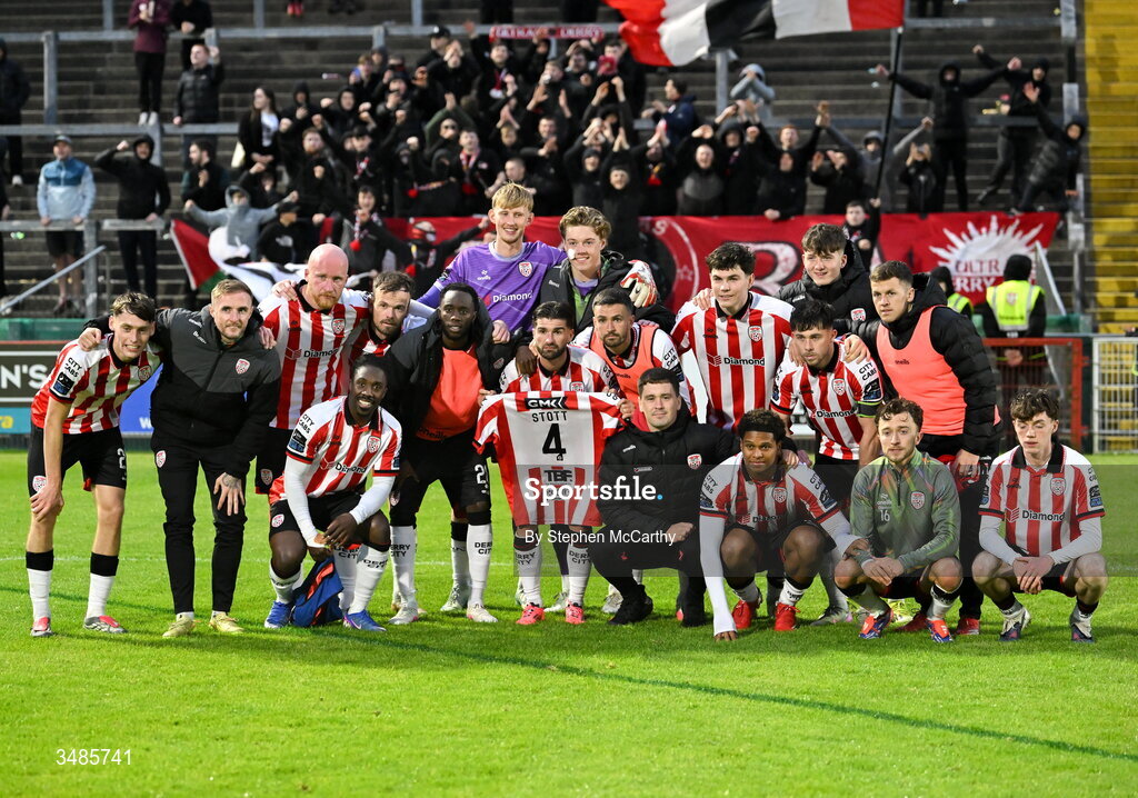 12 June 2026; Derry City players pose for a photograph while holding up a jersey belong to team-mate Jamie Stott after the SSE Airtricity Men’s Premier Division match between Derry City and Bohemians at Find Insurance Celtic Park in Derry. Photo by Stephen McCarthy/Sportsfile