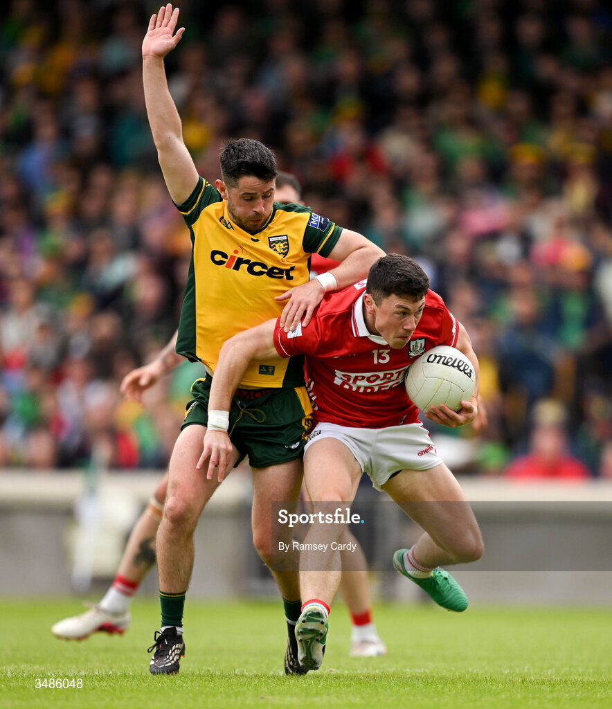 13 June 2026; Mark Cronin of Cork in action against Ryan McHugh of Donegal during the GAA Football All-Ireland Senior Championship Round 2A match between Donegal and Cork at MacCumhaill Park in Ballybofey, Donegal. Photo by Ramsey Cardy/Sportsfile