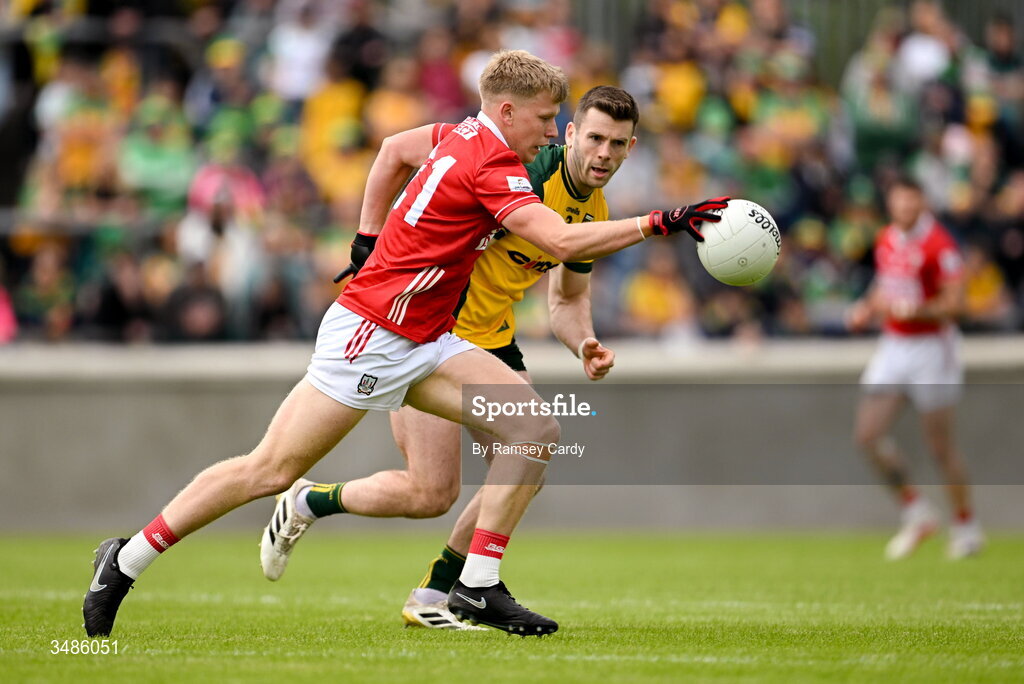 13 June 2026; Dara Sheedy of Cork in action against Eoghan Bán Gallagher of Donegal during the GAA Football All-Ireland Senior Championship Round 2A match between Donegal and Cork at MacCumhaill Park in Ballybofey, Donegal. Photo by Ramsey Cardy/Sportsfile
