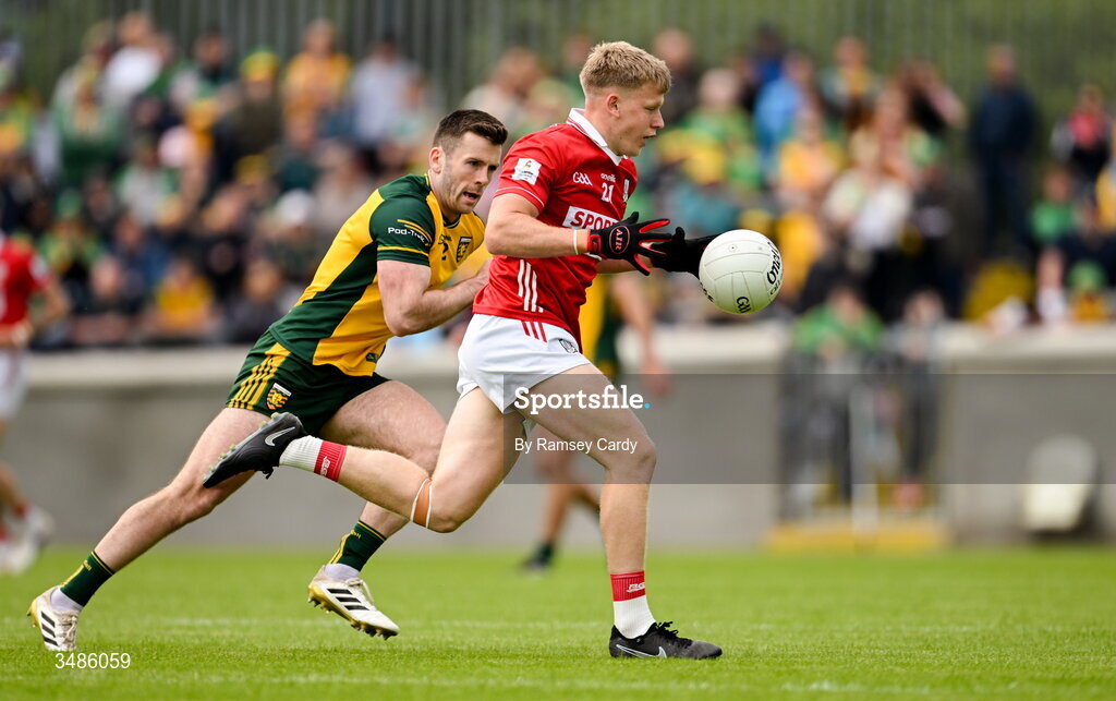13 June 2026; Dara Sheedy of Cork in action against Eoghan Bán Gallagher of Donegal during the GAA Football All-Ireland Senior Championship Round 2A match between Donegal and Cork at MacCumhaill Park in Ballybofey, Donegal. Photo by Ramsey Cardy/Sportsfile