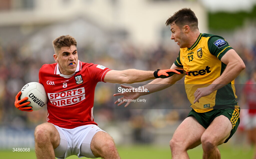13 June 2026; Ian Maguire of Cork in action against Conor O' Donnell of Donegal during the GAA Football All-Ireland Senior Championship Round 2A match between Donegal and Cork at MacCumhaill Park in Ballybofey, Donegal. Photo by Ramsey Cardy/Sportsfile