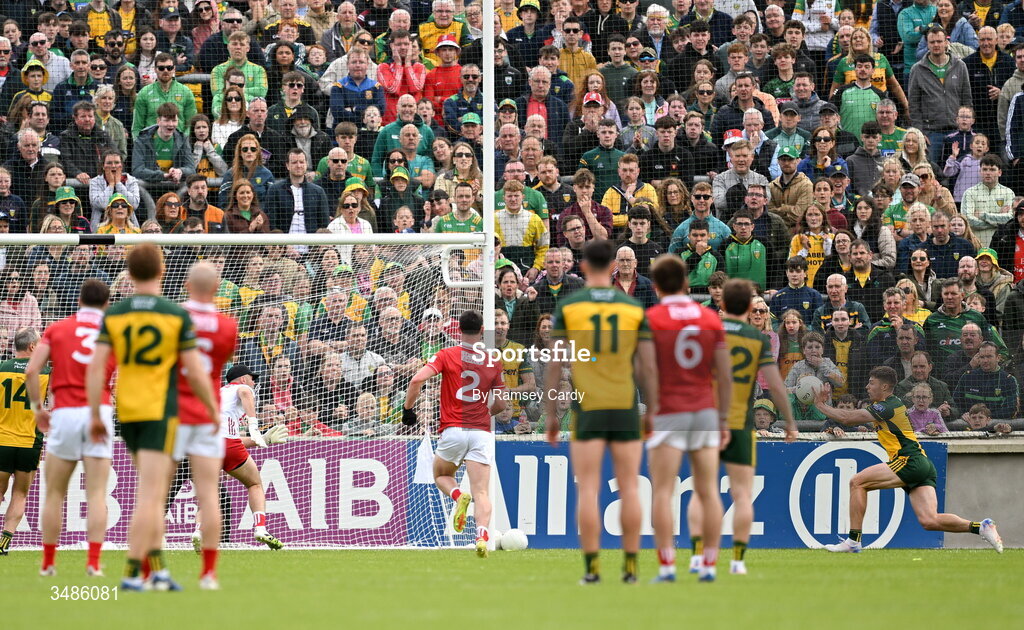 13 June 2026; Conor O'Donnell of Donegal, right, scores his side's first goal during the GAA Football All-Ireland Senior Championship Round 2A match between Donegal and Cork at MacCumhaill Park in Ballybofey, Donegal. Photo by Ramsey Cardy/Sportsfile