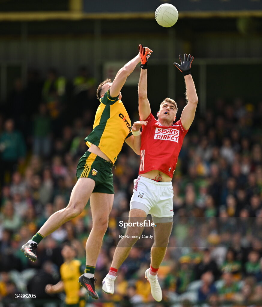 13 June 2026; Jason McGee of Donegal and Ian Maguire of Cork compete for the throw-in of the second half of the GAA Football All-Ireland Senior Championship Round 2A match between Donegal and Cork at MacCumhaill Park in Ballybofey, Donegal. Photo by Ramsey Cardy/Sportsfile