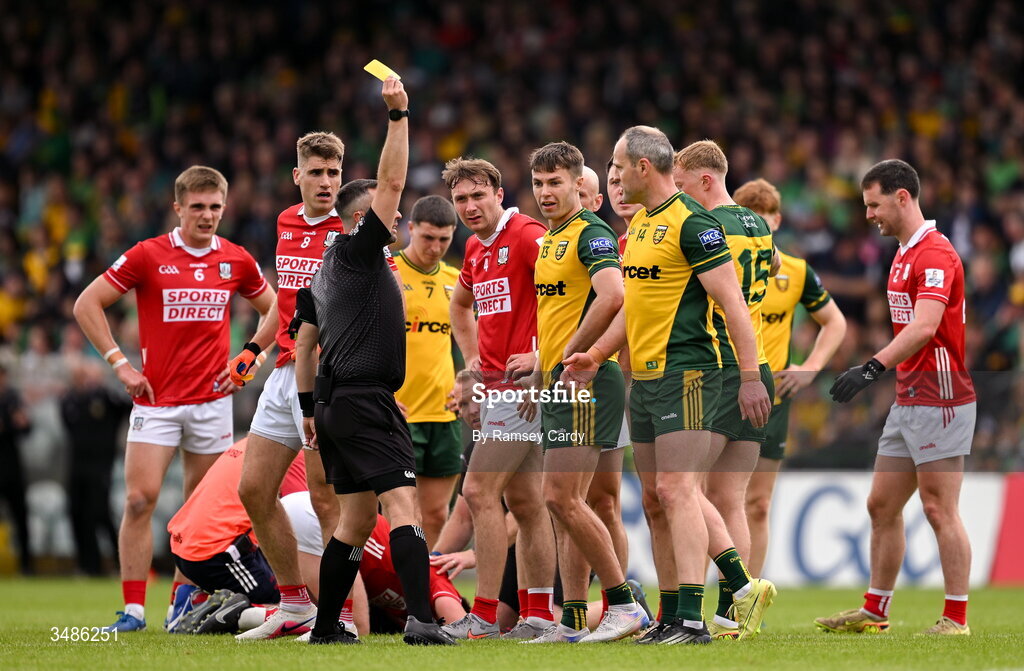 13 June 2026; Michael Murphy of Donegal receives a yellow card from referee David Gough during the GAA Football All-Ireland Senior Championship Round 2A match between Donegal and Cork at MacCumhaill Park in Ballybofey, Donegal. Photo by Ramsey Cardy/Sportsfile