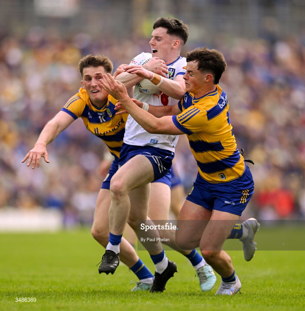 13 June 2026; Stephen O'Hanlon of Monaghan is tackled by Dylan Ruane and Eoin Ward of Roscommon during the GAA Football All-Ireland Senior Championship Round 2B match between Monaghan and Roscommon at St. Tiernach's Park in Clones, Monaghan. Photo by Paul Phelan/Sportsfile