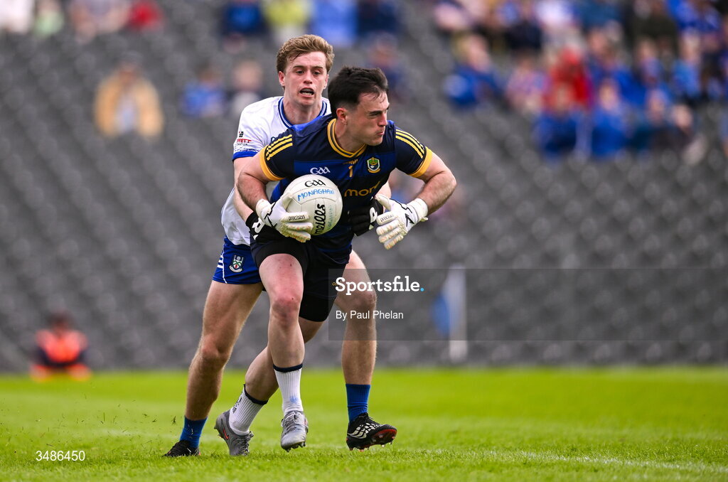 13 June 2026; Roscommon goalkeeper Conor Carroll in action against Karl Gallagher of Monaghan during the GAA Football All-Ireland Senior Championship Round 2B match between Monaghan and Roscommon at St. Tiernach's Park in Clones, Monaghan. Photo by Paul Phelan/Sportsfile