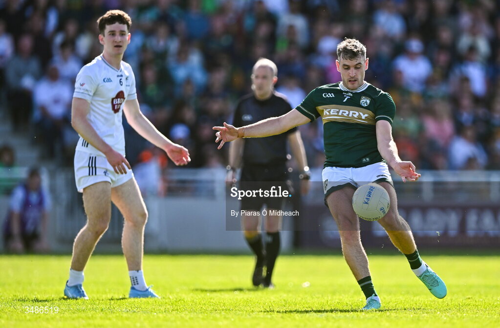13 June 2026; Graham O'Sullivan of Kerry shoots as Padraic Spillane of Kildare looks on during the GAA Football All-Ireland Senior Championship Round 2B match between Kildare and Kerry at Cedral St Conleth's Park in Newbridge, Kildare. Photo by Piaras Ó Mídheach/Sportsfile