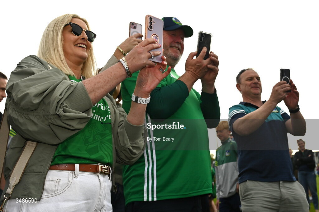 13 June 2026; Limerick supporters take photos after the Electric Ireland All-Ireland Minor Hurling Championship semi-final match between Galway and Limerick at Zimmer Biomet Páirc Chíosóg in Ennis, Clare. Photo by Tom Beary/Sportsfile
