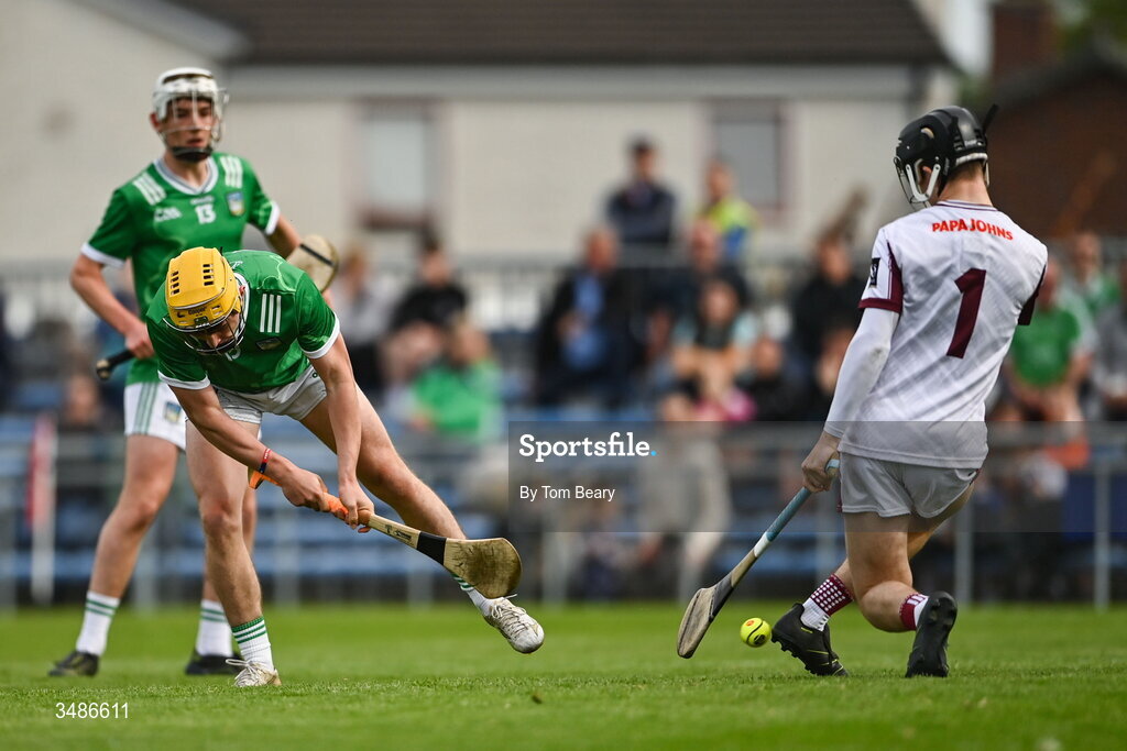 13 June 2026; Rian Horgan of Limerick has a short at goal saved by Galway goalkeeper Mark Walsh during the Electric Ireland All-Ireland Minor Hurling Championship semi-final match between Galway and Limerick at Zimmer Biomet Páirc Chíosóg in Ennis, Clare. Photo by Tom Beary/Sportsfile