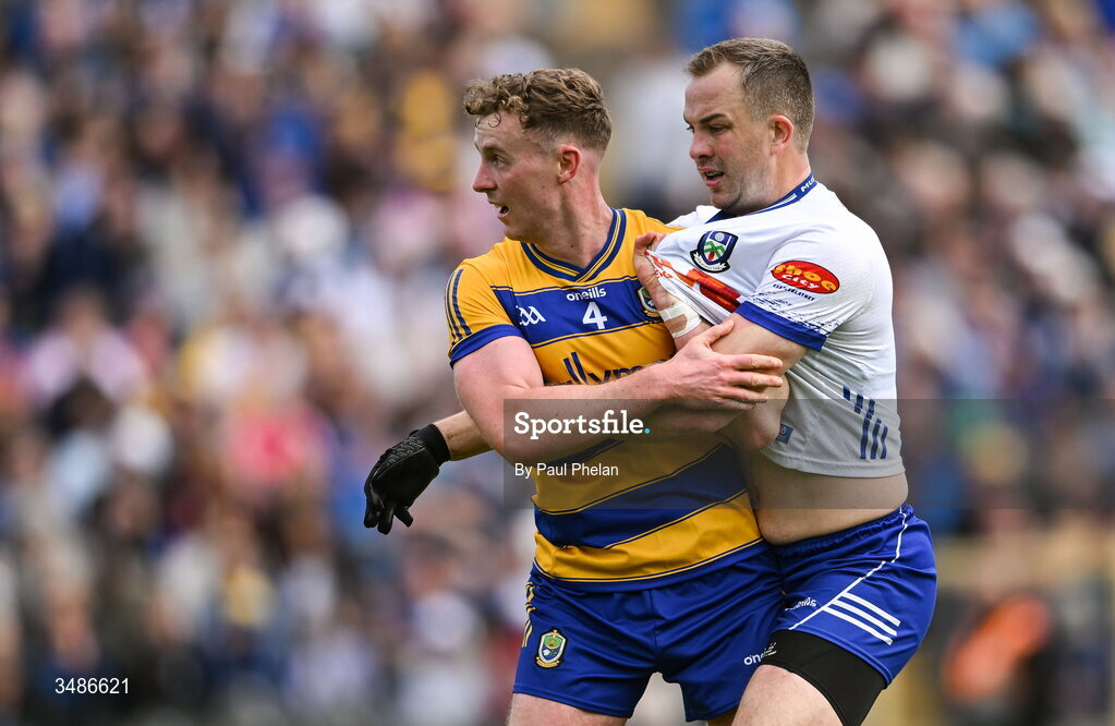 13 June 2026; Eoin McCormack of Roscommon and Jack McCarron of Monaghan tussle during the GAA Football All-Ireland Senior Championship Round 2B match between Monaghan and Roscommon at St. Tiernach's Park in Clones, Monaghan. Photo by Paul Phelan/Sportsfile