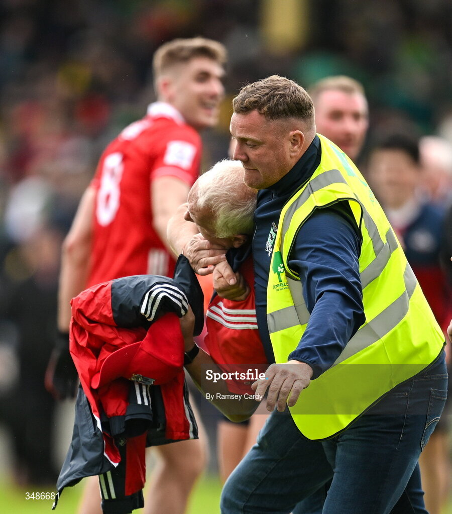 13 June 2026; A steward and a Cork supporter after the GAA Football All-Ireland Senior Championship Round 2A match between Donegal and Cork at MacCumhaill Park in Ballybofey, Donegal. Photo by Ramsey Cardy/Sportsfile