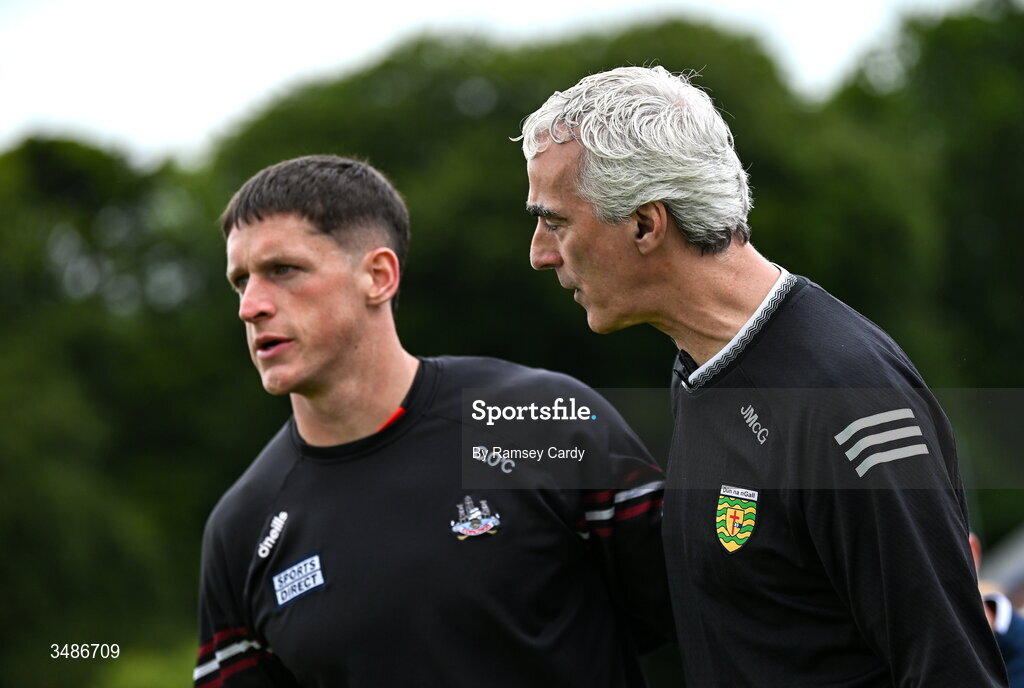 13 June 2026; Donegal manager Jim McGuinness, right, and Colm O'Callaghan of Cork before the GAA Football All-Ireland Senior Championship Round 2A match between Donegal and Cork at MacCumhaill Park in Ballybofey, Donegal. Photo by Ramsey Cardy/Sportsfile