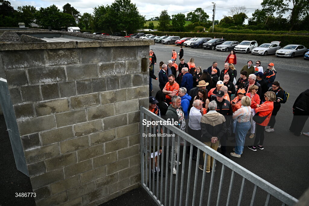 14 June 2026; Armagh supporters await outside the ground for the gates to open, 3 hours before throw-in, before the GAA Football All-Ireland Senior Championship Round 2A match between Louth and Armagh at Páirc Grattan in Inniskeen, Monaghan. Photo by Ben McShane/Sportsfile