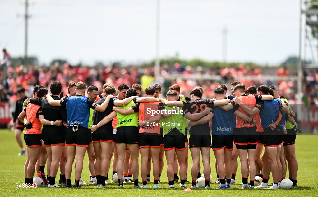 14 June 2026; Armagh players huddle before the GAA Football All-Ireland Senior Championship Round 2A match between Louth and Armagh at Páirc Grattan in Inniskeen, Monaghan. Photo by Ben McShane/Sportsfile