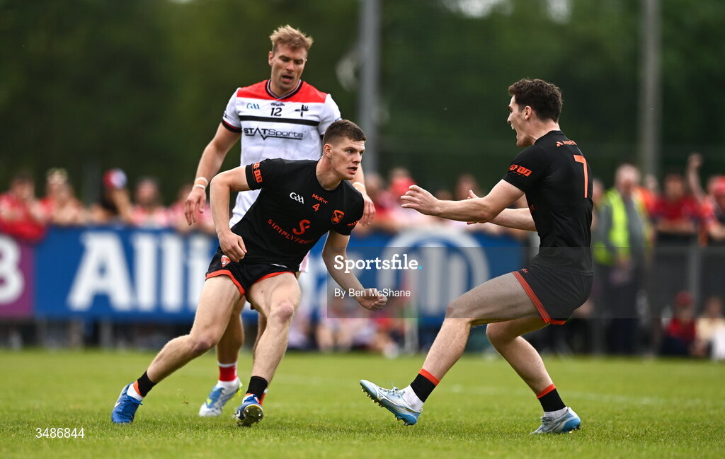 14 June 2026; Gareth Murphy of Armagh, left, celebrates with teammate Jarly Og Burns after scoring their side's first goal during the GAA Football All-Ireland Senior Championship Round 2A match between Louth and Armagh at Páirc Grattan in Inniskeen, Monaghan. Photo by Ben McShane/Sportsfile