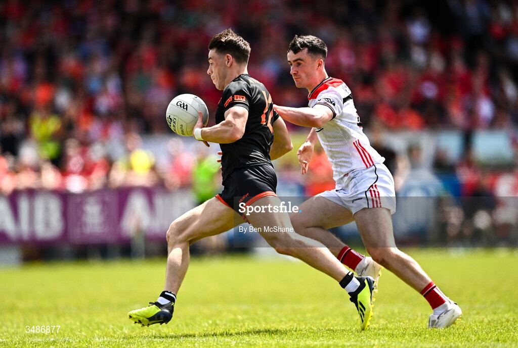 14 June 2026; Tomas McCormack of Armagh in action against Daire Nally of Louth during the GAA Football All-Ireland Senior Championship Round 2A match between Louth and Armagh at Páirc Grattan in Inniskeen, Monaghan. Photo by Ben McShane/Sportsfile