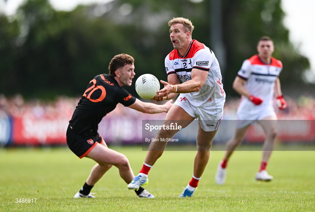 14 June 2026; Conor Grimes of Louth in action against Ross McQuillan of Armagh during the GAA Football All-Ireland Senior Championship Round 2A match between Louth and Armagh at Páirc Grattan in Inniskeen, Monaghan. Photo by Ben McShane/Sportsfile