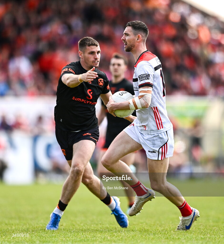 14 June 2026; Ciaran Downey of Louth in action against Greg McCabe of Armagh during the GAA Football All-Ireland Senior Championship Round 2A match between Louth and Armagh at Páirc Grattan in Inniskeen, Monaghan. Photo by Ben McShane/Sportsfile